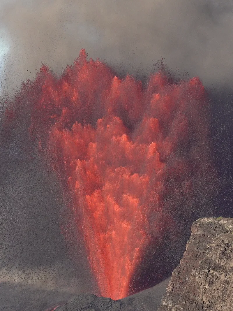 Daytime frame showing an active Kīlauea lava fountain viewed from the Kīlauea Overlook.